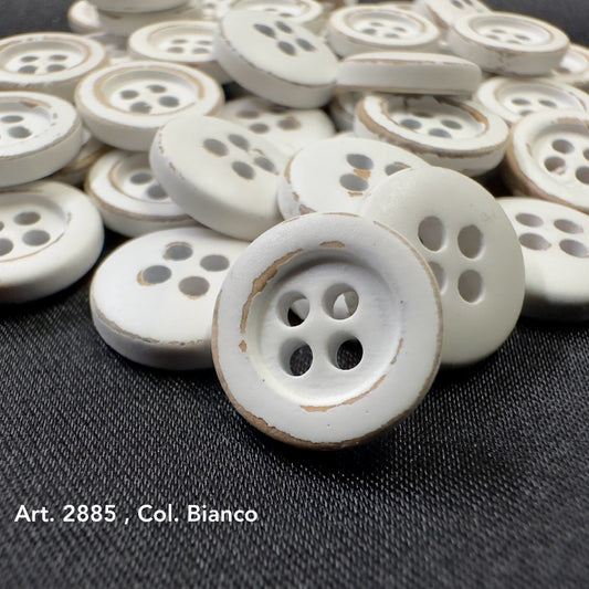 White wooden buttons for sewing with four holes and a rustic finish, perfect for crafts and garments