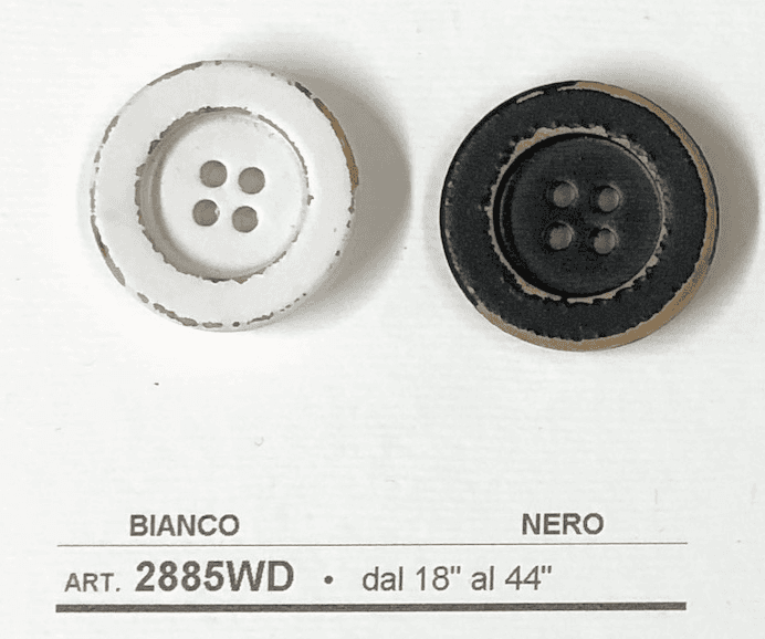 Two buttons from Buttonology Inc, featuring a distressed white wooden button for sewing and a black button