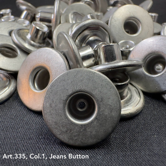 Wholesale jean button supply by Buttonology Inc with multiple silver metal jean buttons on fabric