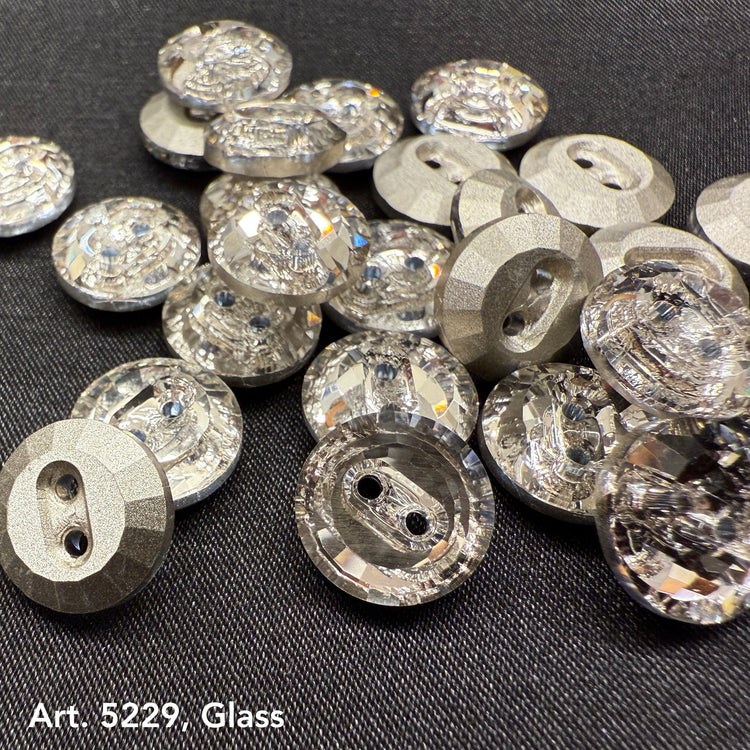 Buy glass buttons for garments featuring high-quality clear faceted round designs on dark fabric