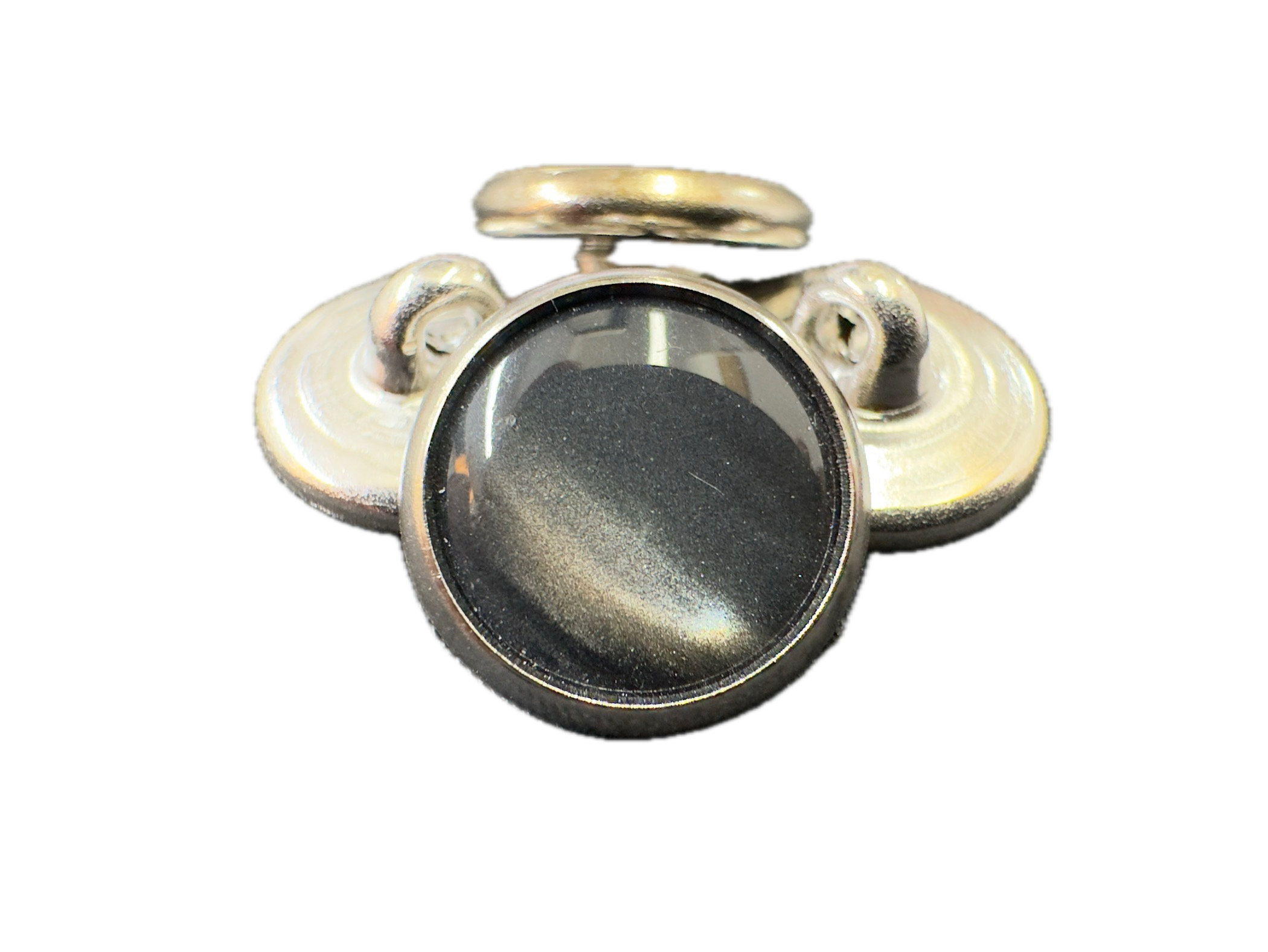 Gold and silver cufflinks with a central stone on a white background