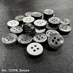 Assorted 4-hole sewing buttons for clothing in gray shades with shiny finish