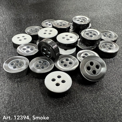 Assorted 4-hole sewing buttons for clothing in gray shades with shiny finish