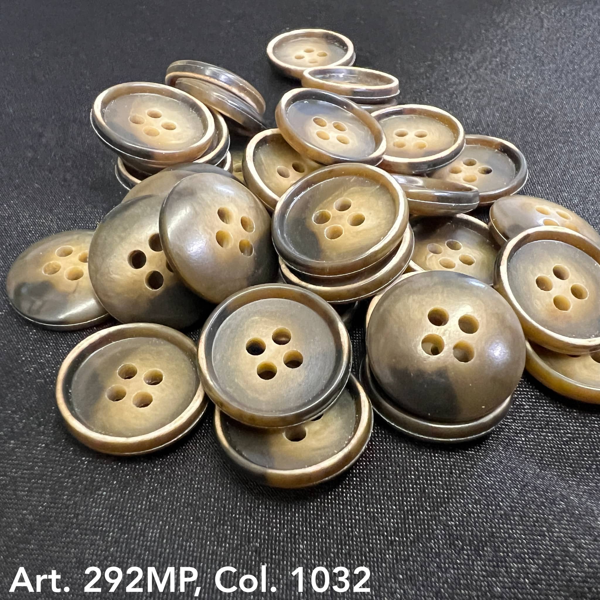 Assorted 4-hole suit buttons from Buttonology Inc in various sizes and colors for durable garment use