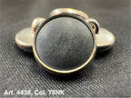 Buttonology Inc polyester garment shank round metal shank button with black center on textured fabric