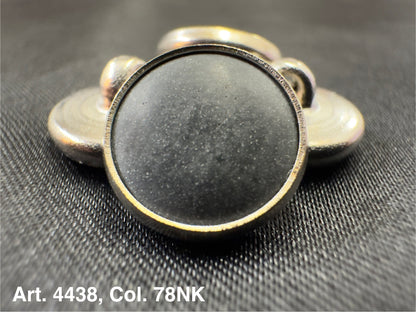 Buttonology Inc polyester garment shank round metal shank button with black center on textured fabric