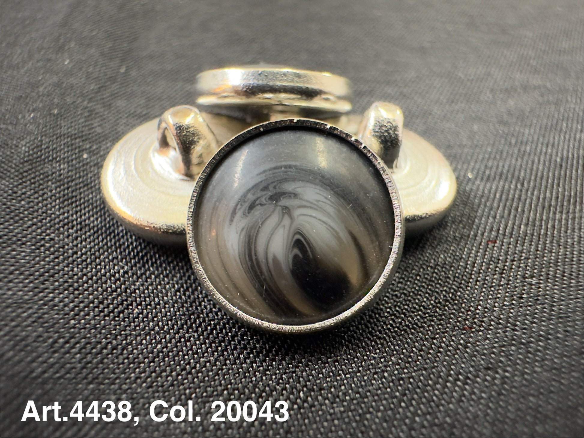 Buttonology Inc metal shank button with marbled gray dome on black fabric polyester garment shank for coats and jackets
