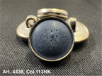 Buttonology Inc metal button shank with textured black enamel center on black fabric polyester garment shank