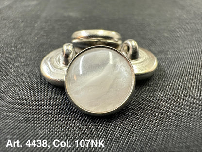 Buttonology Inc polyester garment shank with pearlescent white cabochon and silver metal rim on black fabric