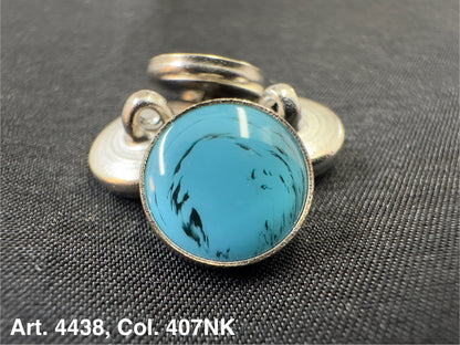 Buttonology Inc polyester garment shank turquoise cabochon set in silver metal decorative shank button on black fabric