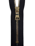 Black zipper with gold metal teeth on a white background