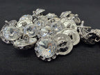 Collection of crystal buttons on a black background