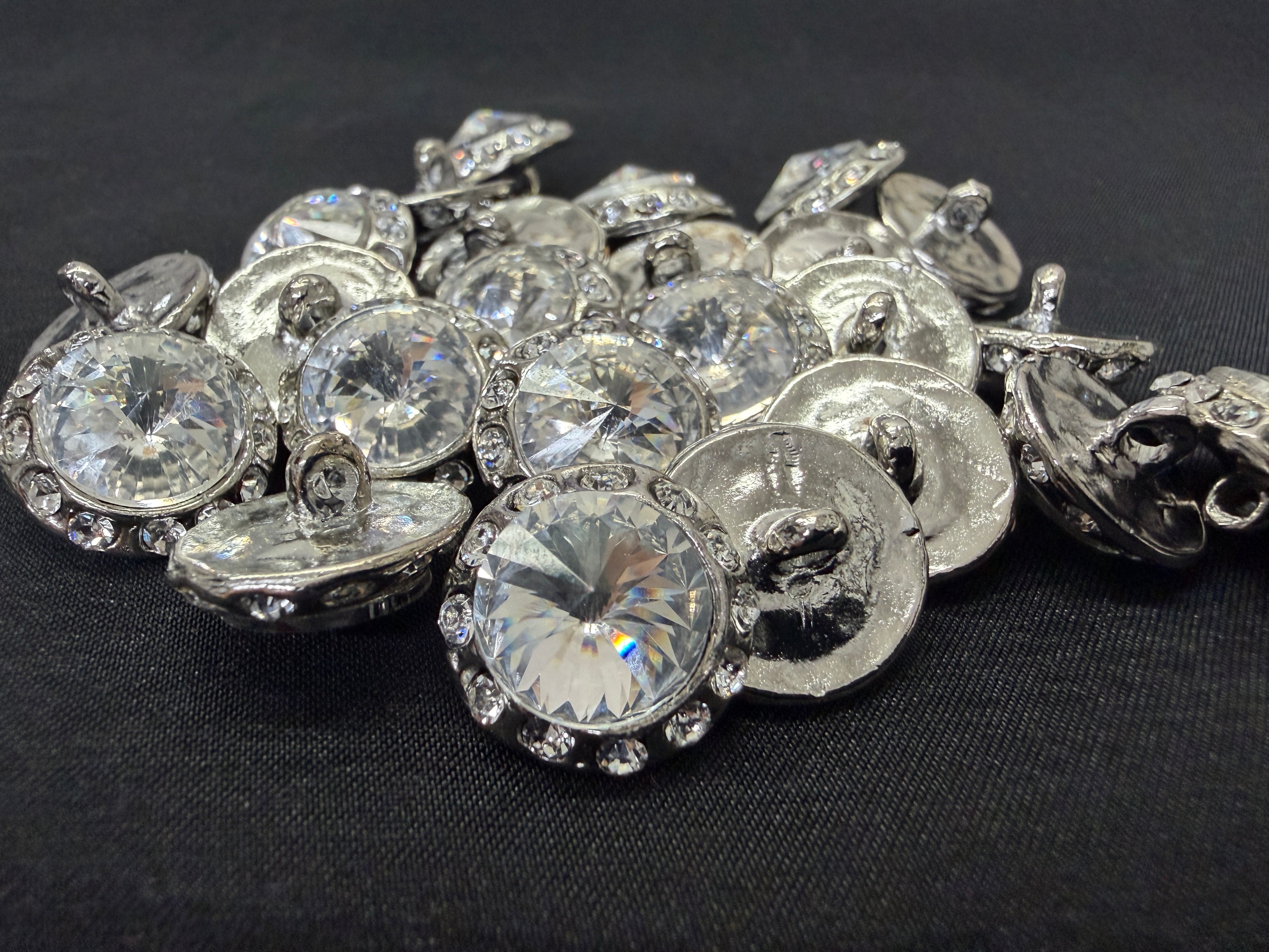Collection of crystal buttons on a black background