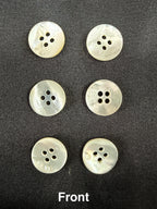 Six white buttons with four holes on a black background, labeled 'Front'.