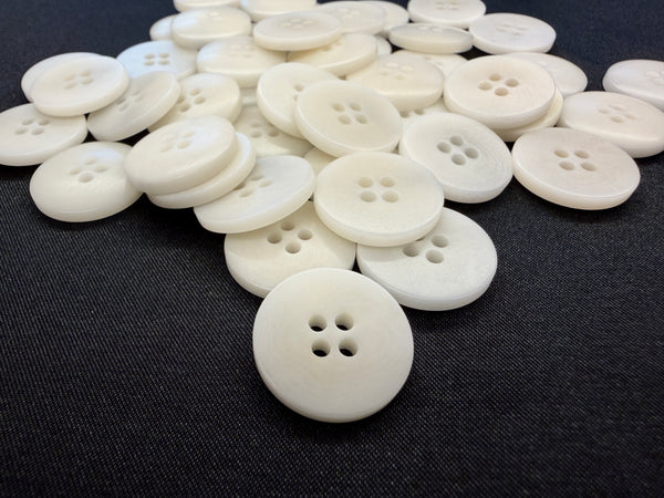 Natural corozo 4-hole buttons in ivory, 28L group view - Art. 10417