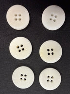Ivory corozo 4-hole buttons arranged in rows, 28L 18mm - Art. 10417