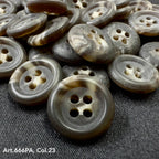 Close-up of Buttonology Inc recycled paper buttons in gray and brown tones with four holes