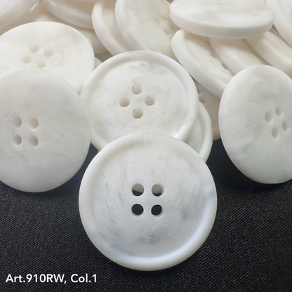 Buttonology Inc white marbled four hole round coat buttons for sewing stacked on dark fabric background