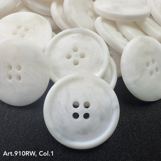 Buttonology Inc white marbled four hole round coat buttons for sewing stacked on dark fabric background
