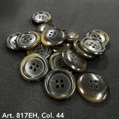 Premium sewing buttons online by Buttonology Inc four-hole round grey and brown buttons on black fabric