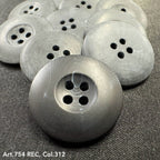 Gray round buttons with four holes showcasing custom button designs by Buttonology Inc