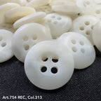 White buttons with four holes on black fabric showcasing custom button designs by Buttonology Inc