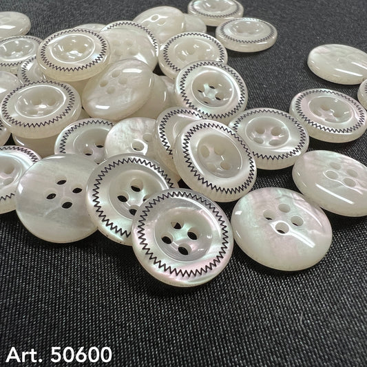 Best buttons for home sewing by Buttonology Inc featuring white round buttons with black zigzag edge design