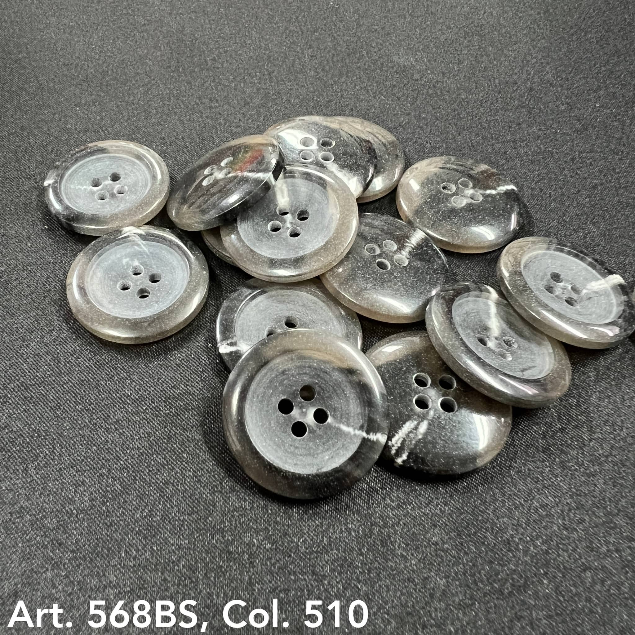 Set of black 4-hole garment buttons with a polished finish and unique marble patterns