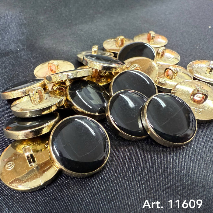 Black and gold shank buttons from Buttonology Inc with shiny gold edges and smooth black centers