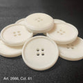Buttonology Inc white four hole round sewing buttons on black fabric for wholesale button supplies online