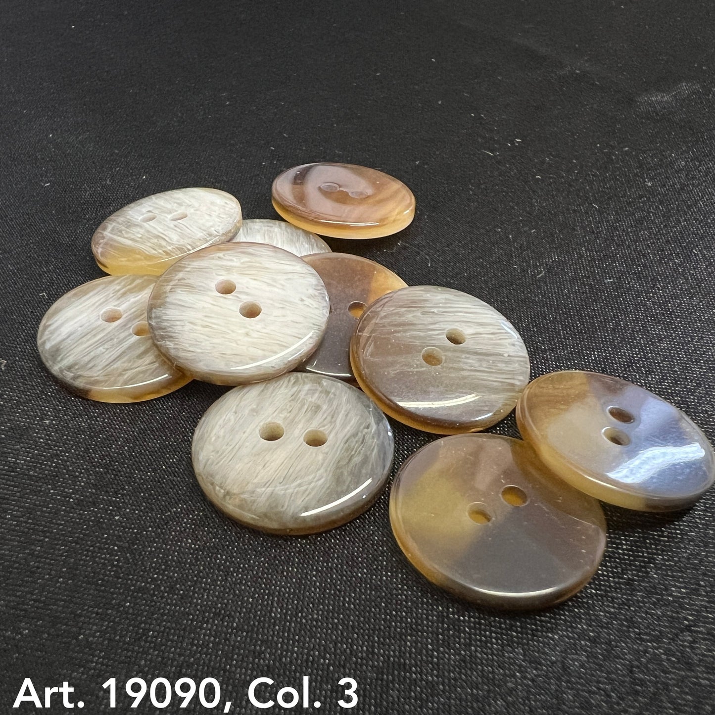 Buy Two Hole Buttons Online - round brown and beige buttons by Buttonology Inc on black fabric