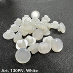 White buttons from Buttonology Inc for button sewing supplies on dark fabric background