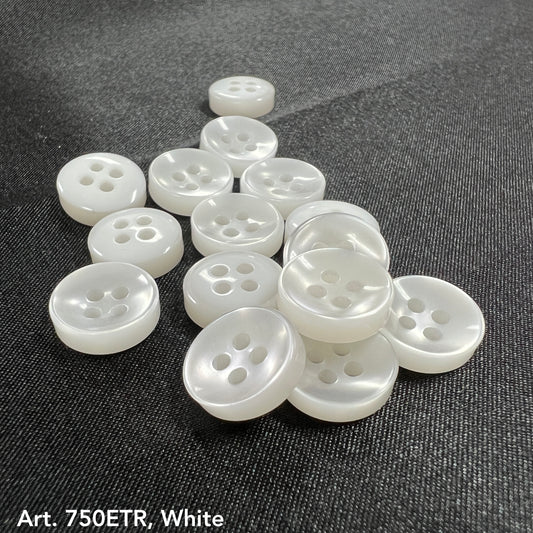 White four-hole round sewing buttons on dark fabric from Buttonology Inc wholesale button supplies