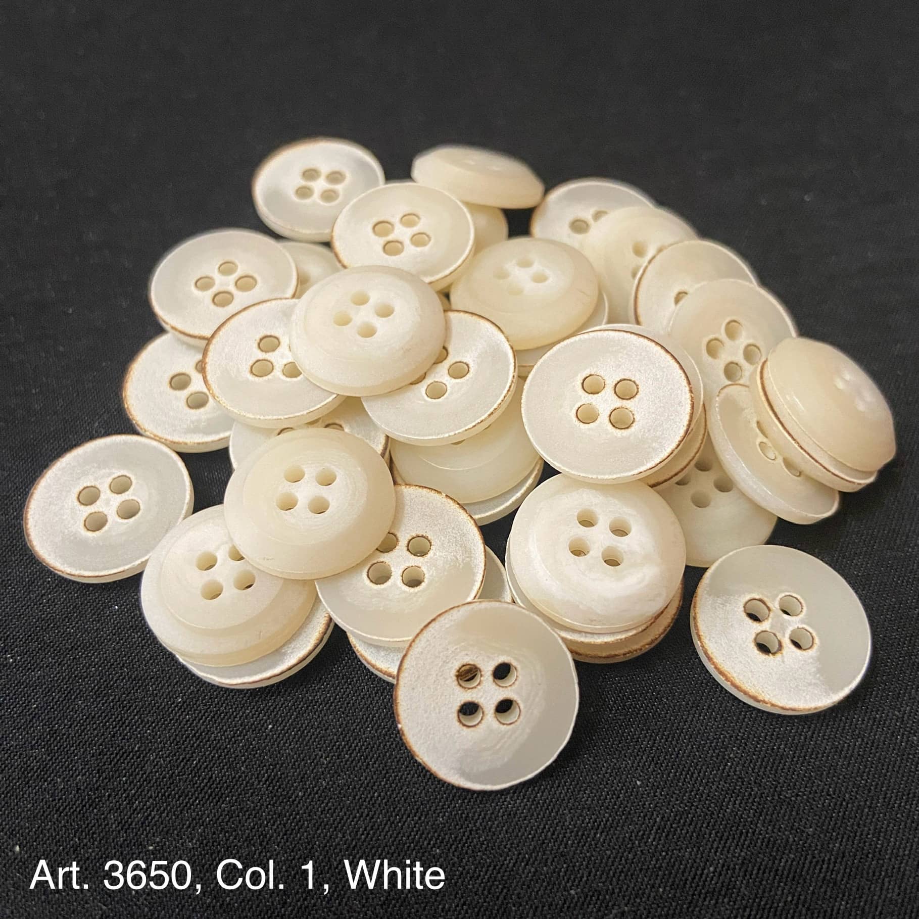 Collection of White 4-Hole Buttons for Shirts and Blouses in Various Sizes by Buttonology Inc.
