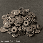 Assorted black buttons for shirts and blouses with a classic four-hole design from Buttonology Inc.