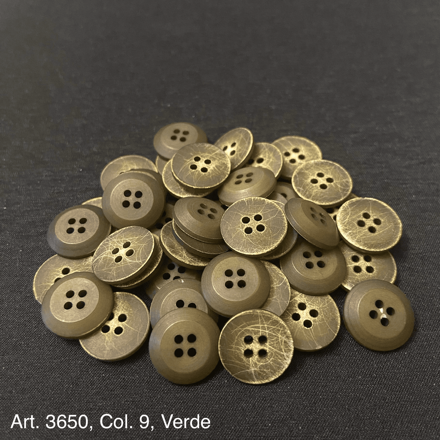 Set of decorative buttons for shirts and blouses in green with four holes for easy sewing