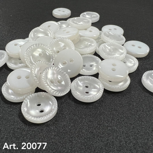 White pearlized two hole buttons with rope edge on dark fabric by Buttonology Inc sew-on buttons for shirts