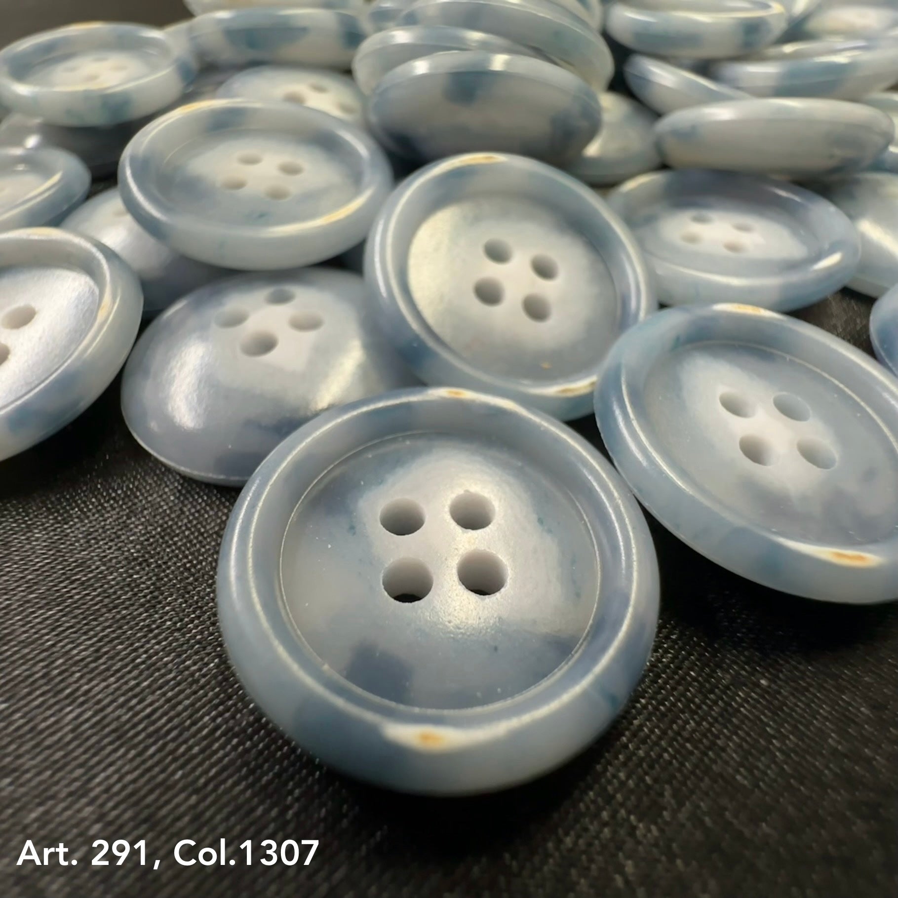 Coat buttons for sewing by Buttonology Inc in blue with four holes, ideal for crafting and garment repair