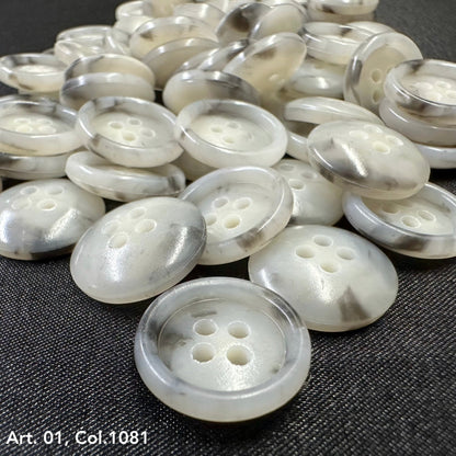 Assorted coat buttons for sewing in a glossy white finish with four holes for easy attachment