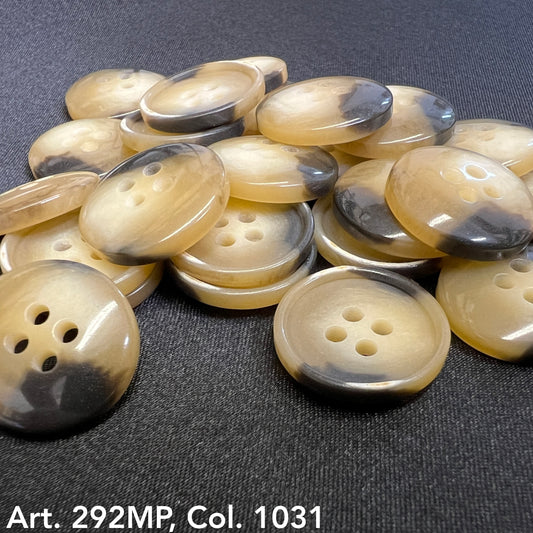 Collection of coat sizing buttons in cream and black suitable for various garments
