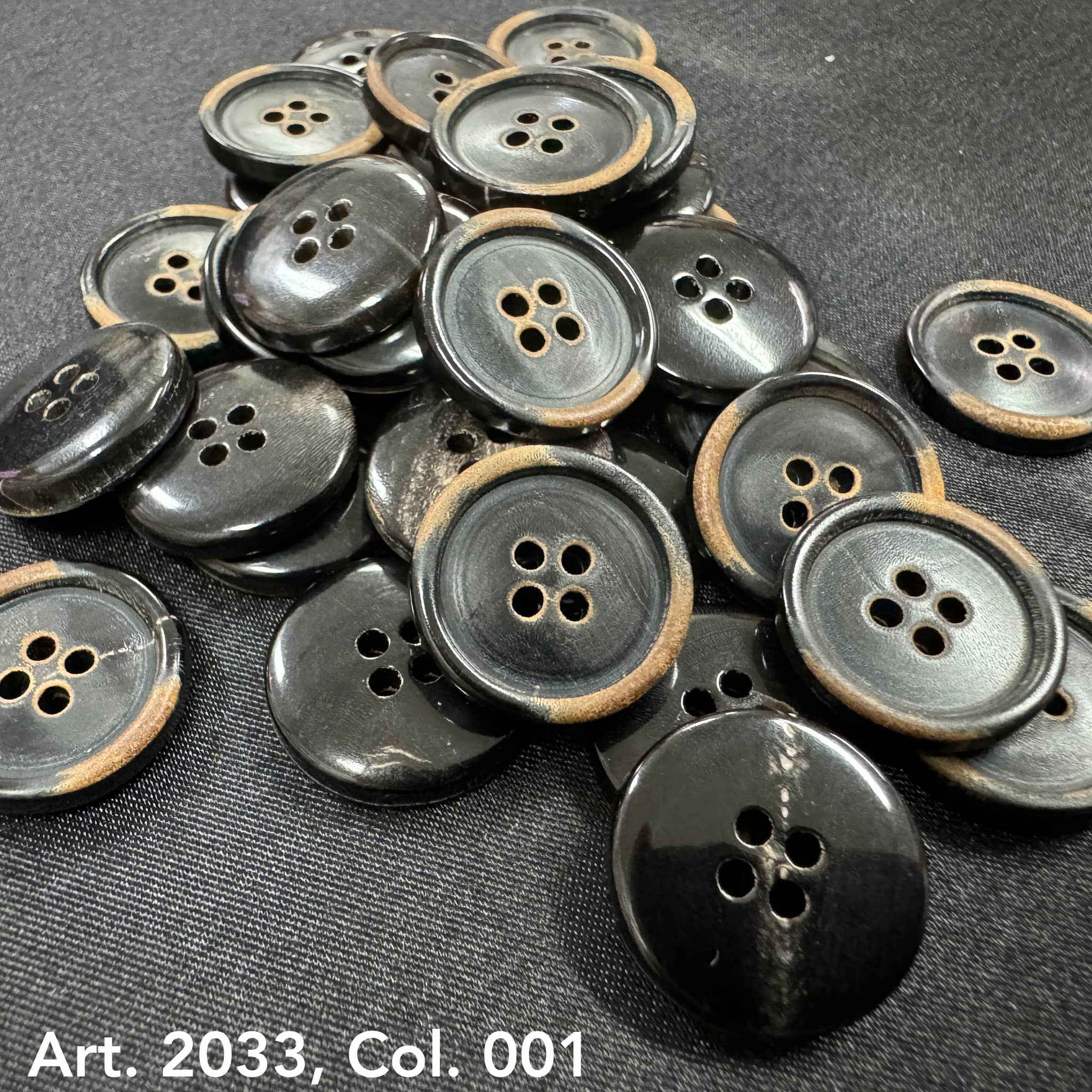 Eco-friendly horn buttons by Buttonology Inc with a black and natural brown edge design