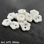 Set of white flower-shaped garment buttons ideal for sewing and craft projects