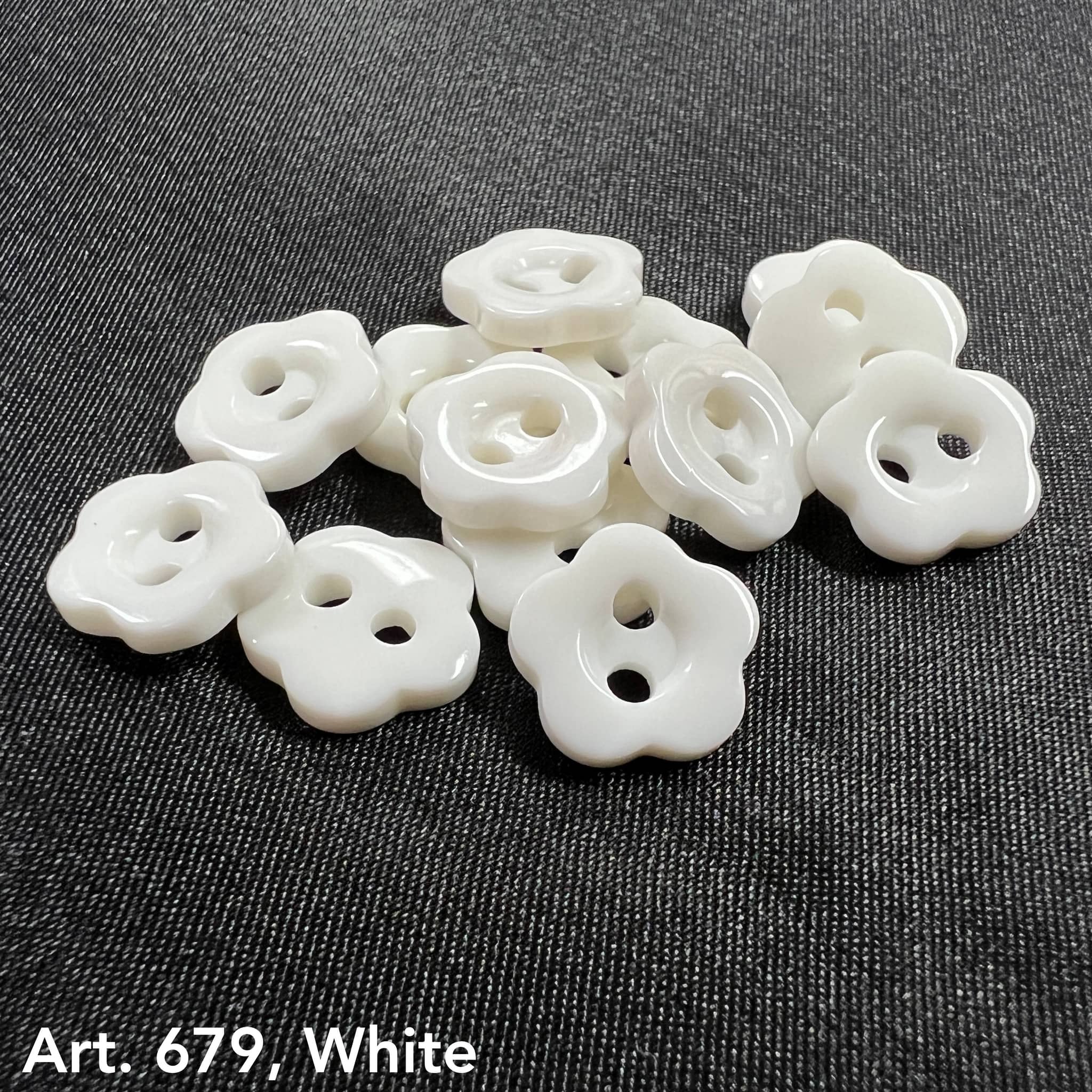 Set of white flower-shaped garment buttons ideal for sewing and craft projects