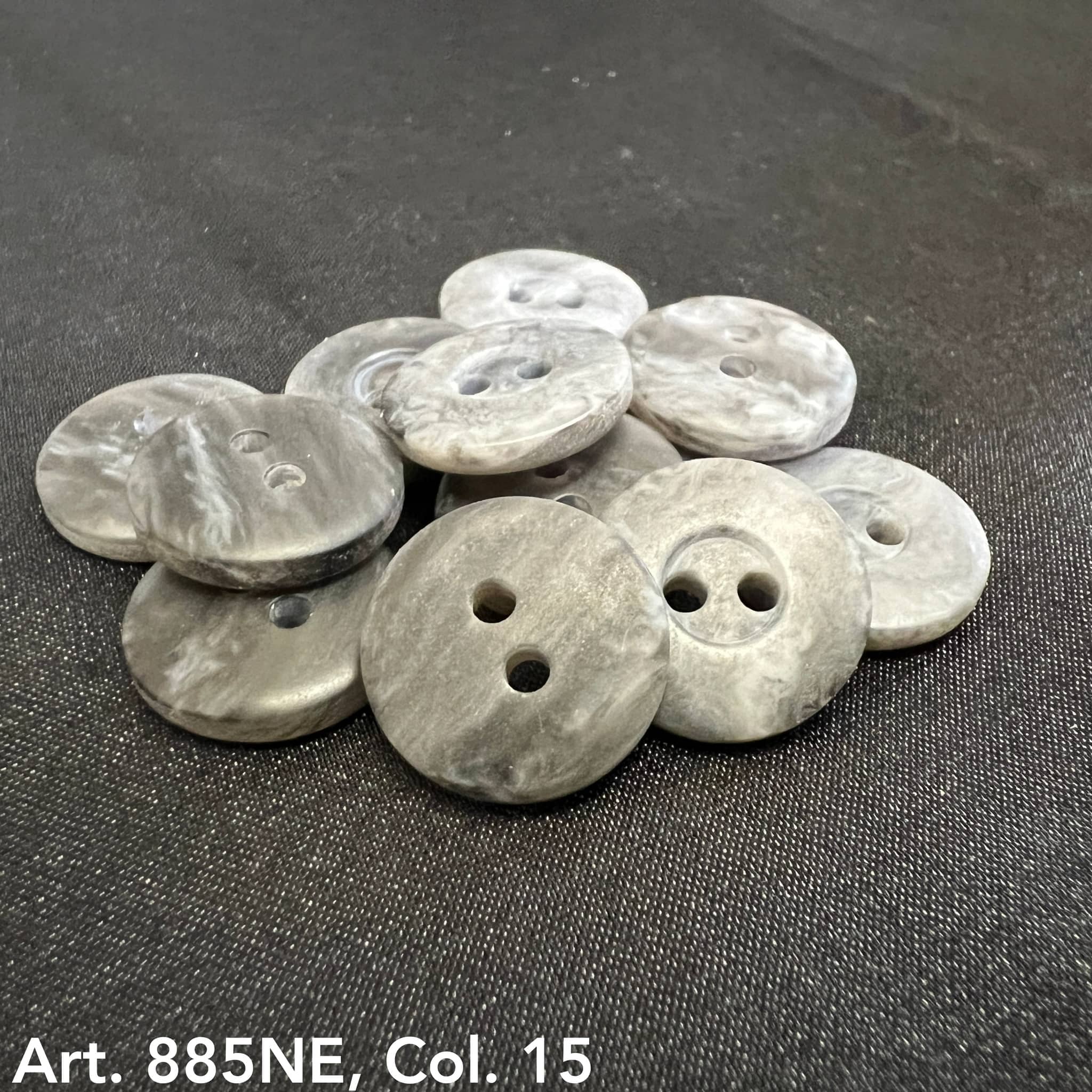 Gray 2-hole garment buttons from Buttonology Inc with a smooth finish for sewing and crafting