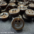 Buttonology Inc 18L four hole plastic buttons in dark brown color on fabric background