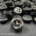18L four hole plastic buttons in black with a shiny finish by Buttonology Inc