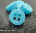 18L four hole plastic buttons in light blue by Buttonology Inc on black fabric background