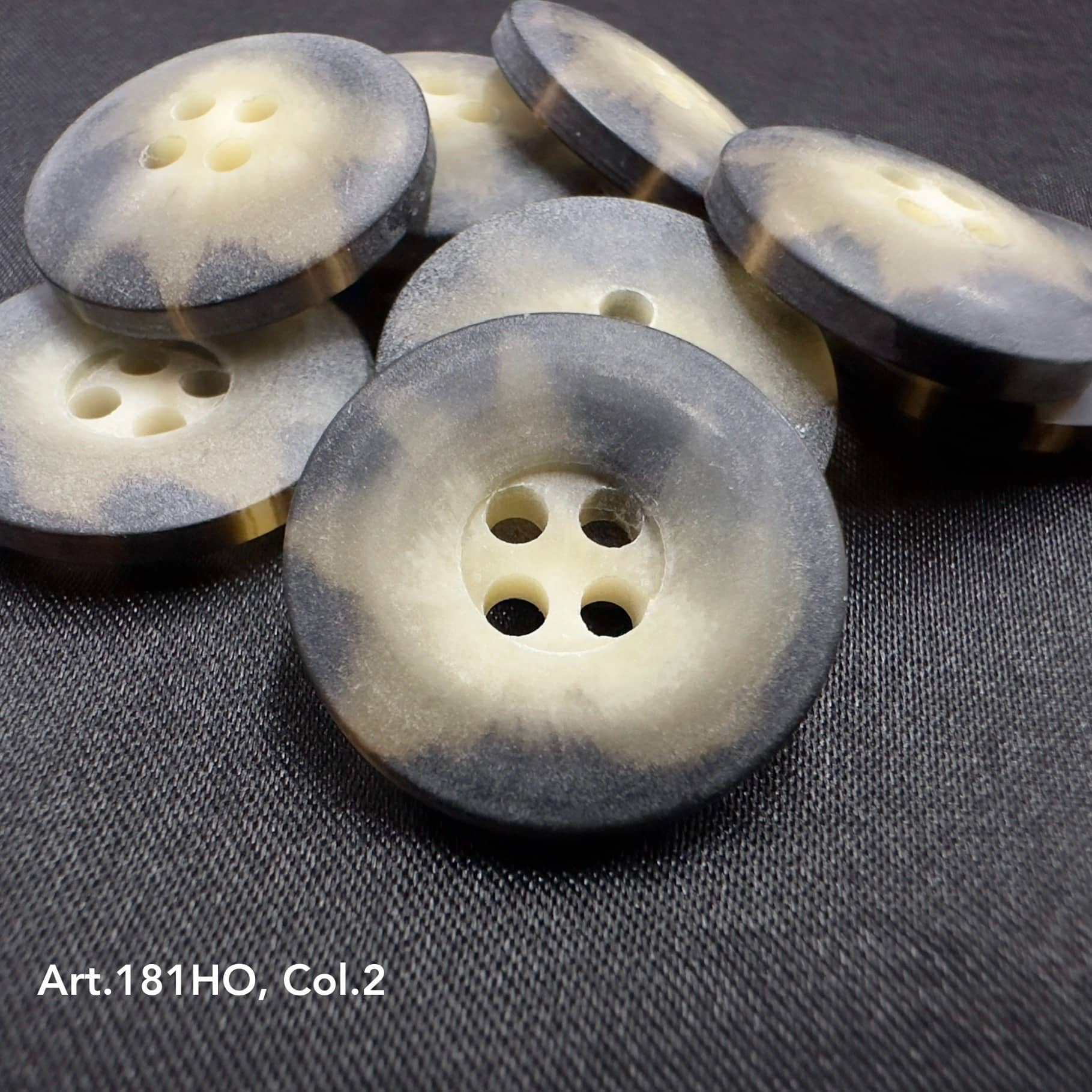 Buttonology Inc polyester resin sewing supplies with round four-hole buttons in gray and cream shades
