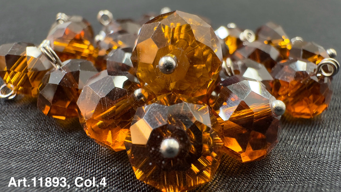Amber glass buttons for sewing with a faceted design and shiny finish from Buttonology Inc.