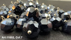 Shiny black glass buttons for sewing with a faceted design and metal loop for easy attachment